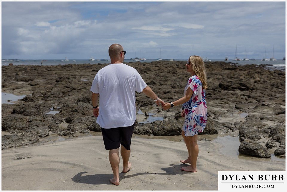 tamarindo beach costa rica photo session couple near rocky reef