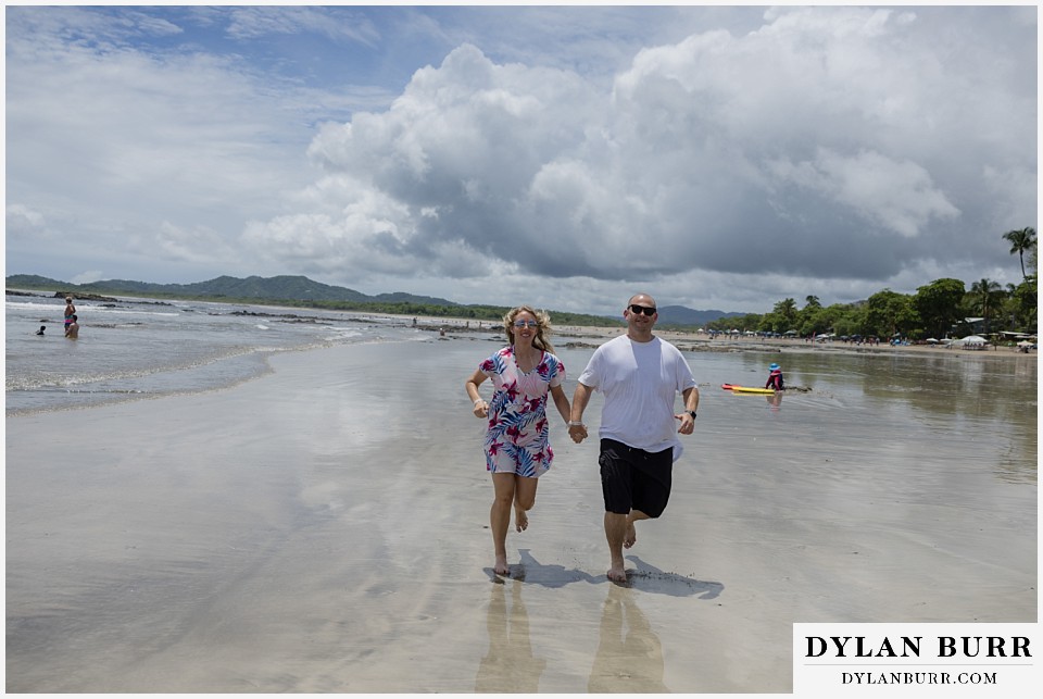 tamarindo beach costa rica photo session couple running on beach