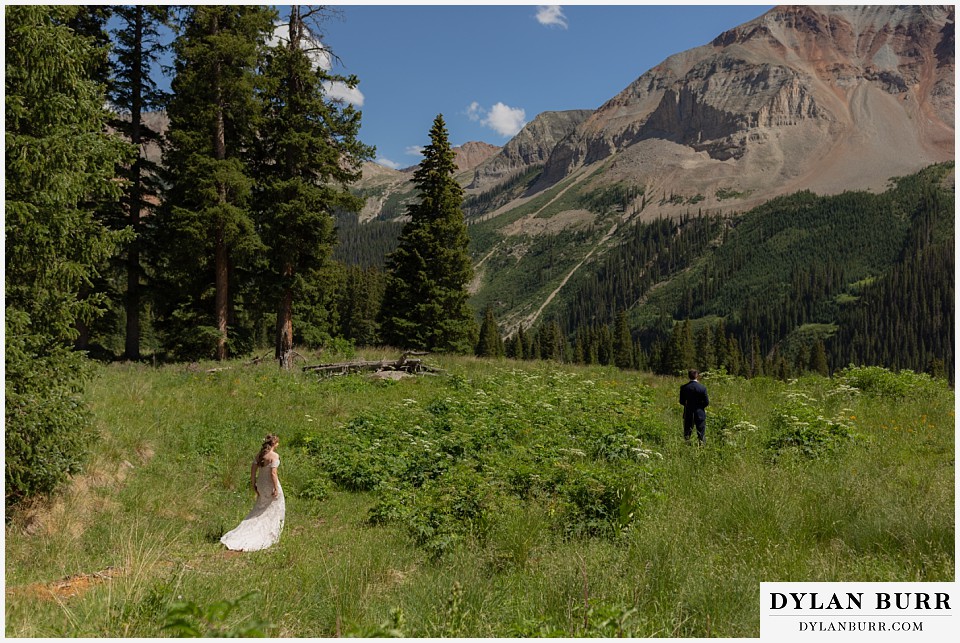 telluride colorado elopement wedding adventure bride walking towards groom first look giant mountain views