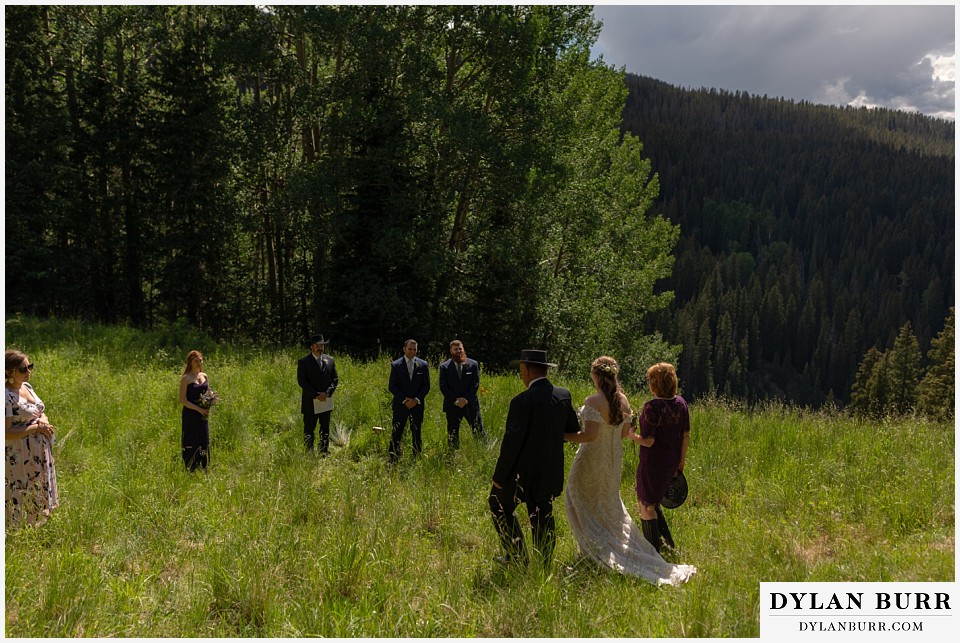 telluride colorado elopement wedding adventure bride walking down mountain with parents
