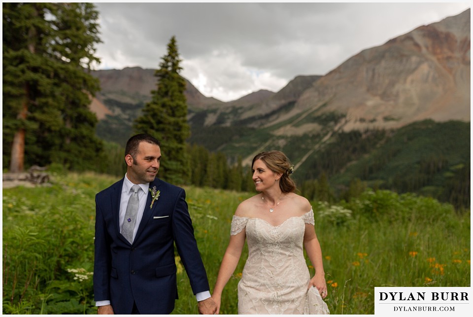 telluride colorado elopement wedding adventure bride and groom looking at each other with love in mountain