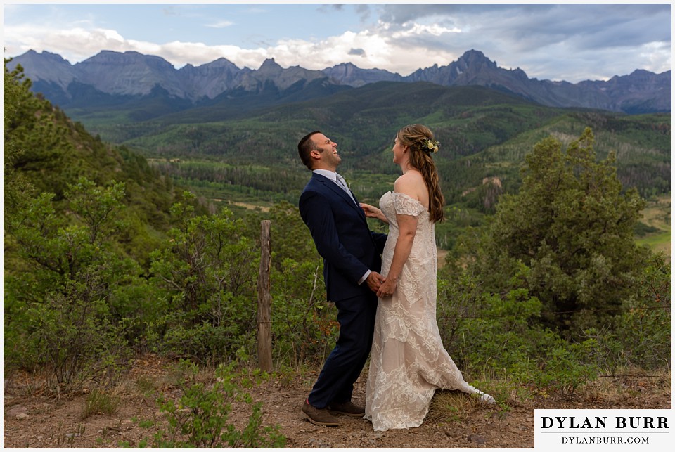 telluride colorado elopement wedding adventure bride and groom laughing together at dallas divide near ridgeway colorado