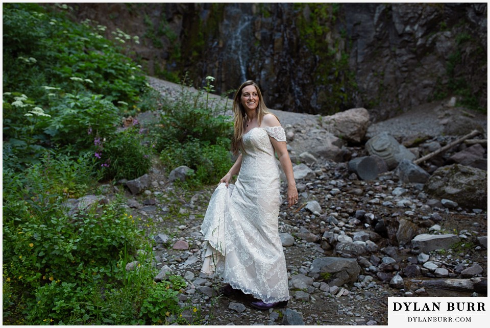uncompahgre national forest colorado elopement wedding adventure bride hiking up to waterfall