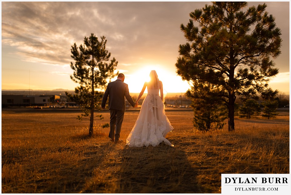 villa parker wedding parker colorado bride and groom walking out into the sunset