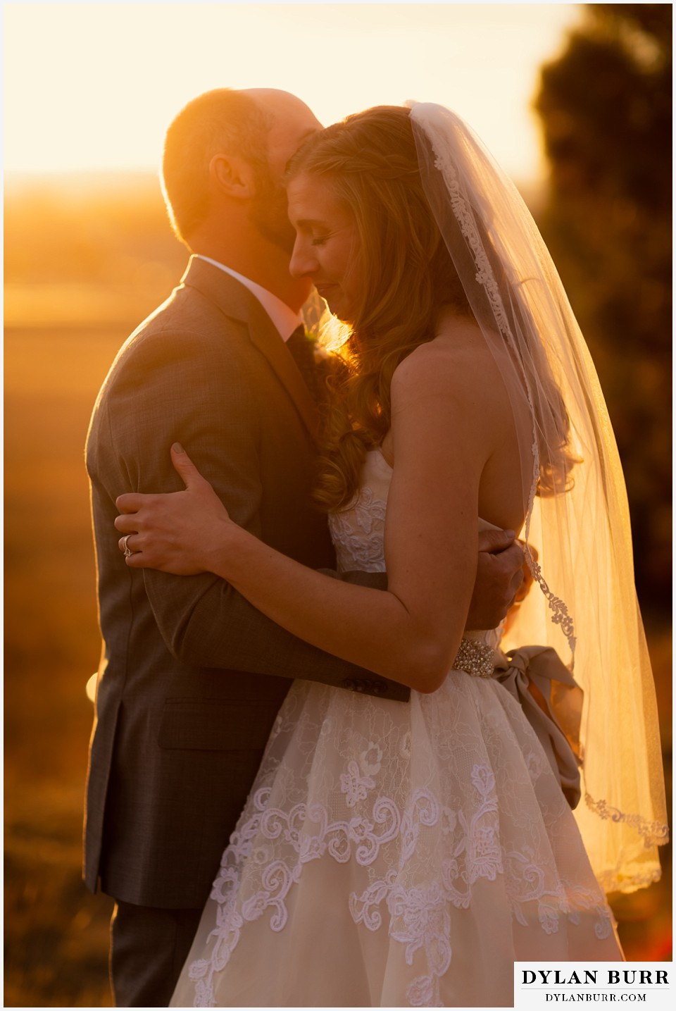 villa parker wedding parker colorado bride and groom together wrapped in sunset light