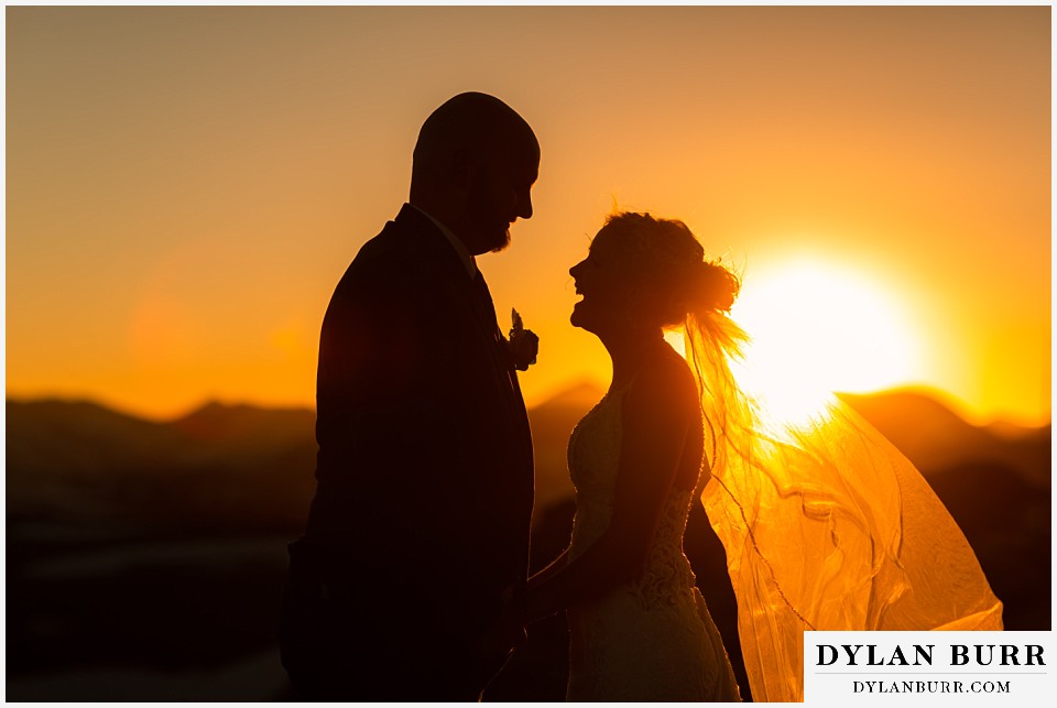 wild basin lodge wedding bride and groom laughing at sunset together