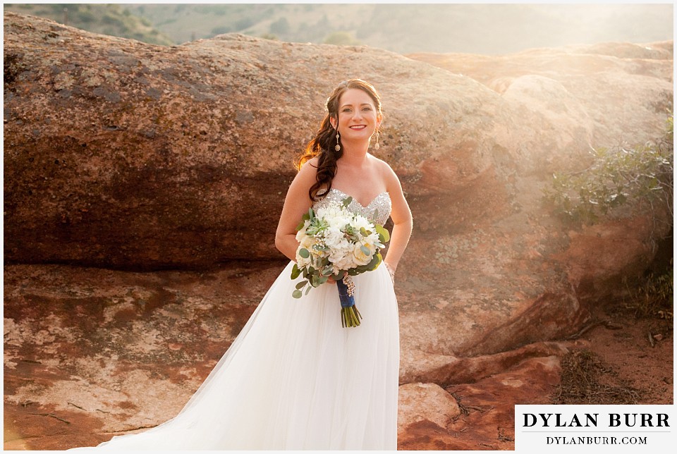 willow ridge manor wedding bride in low sun and large rocks in background