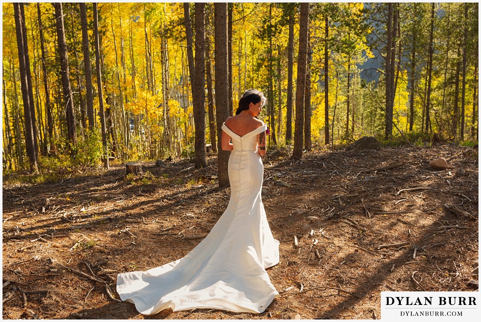 winter park mountain lodge wedding colorado bride alone in yellow aspen trees