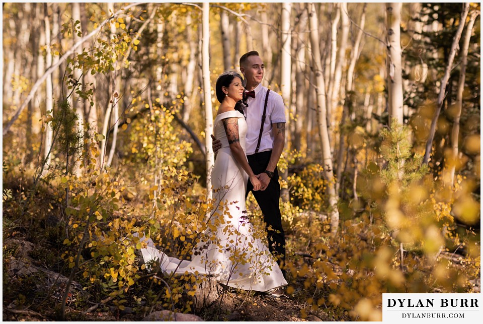 winter park mountain lodge wedding colorado bride and groom standing in sunlight