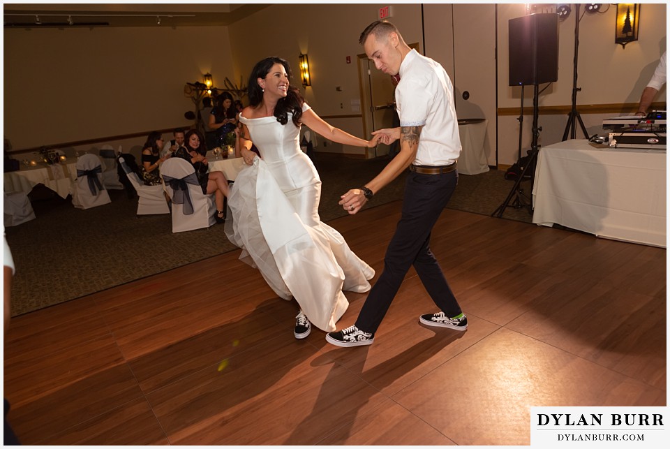 winter park mountain lodge wedding colorado bride and groom dancing in their tennis shoes