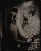 tintype engagement couple kissing holding each other